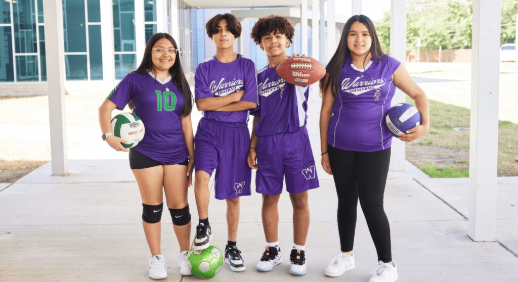 4 Student Athletes Wearing Purple Athletic Attire At Best Charter School Texas Education In Dallas, Tx