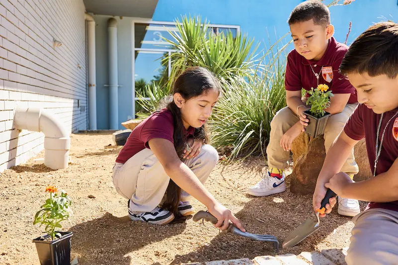 Best Charter School Texas Scholars Enjoying Their Gardening Club